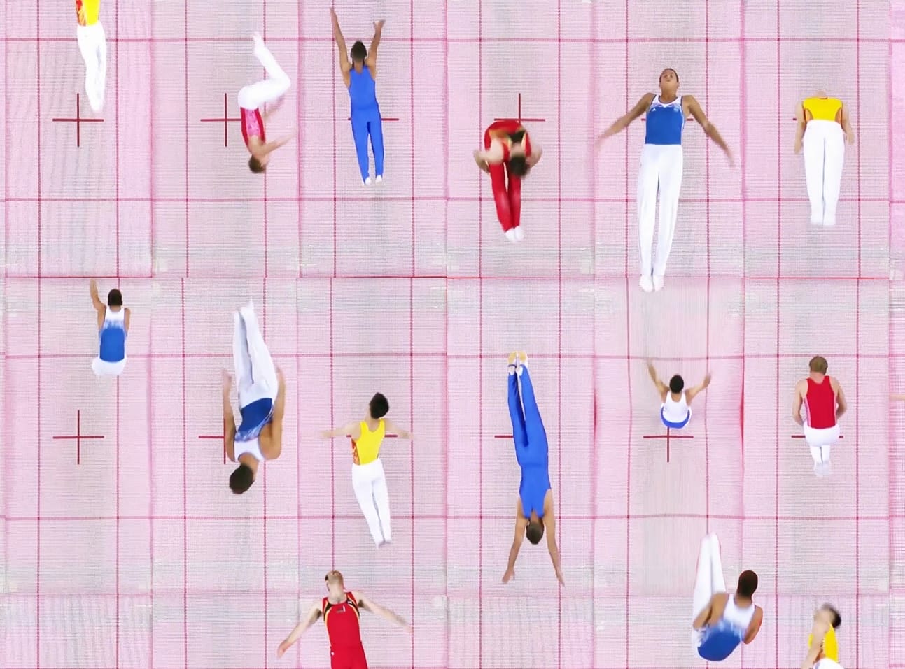 a detail of a still from a video artwork of aerial views of people jumping in pink trampolines