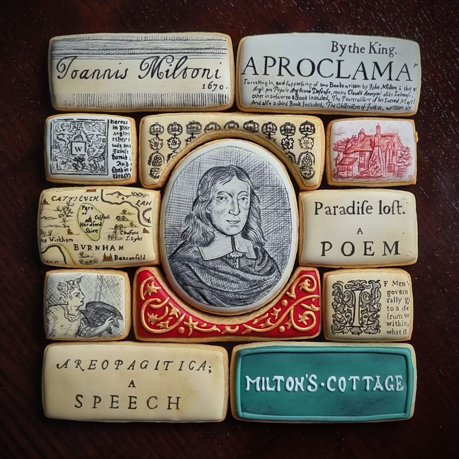 a collection of cookies with a black and white portrait at the center and additional antique typographic works
